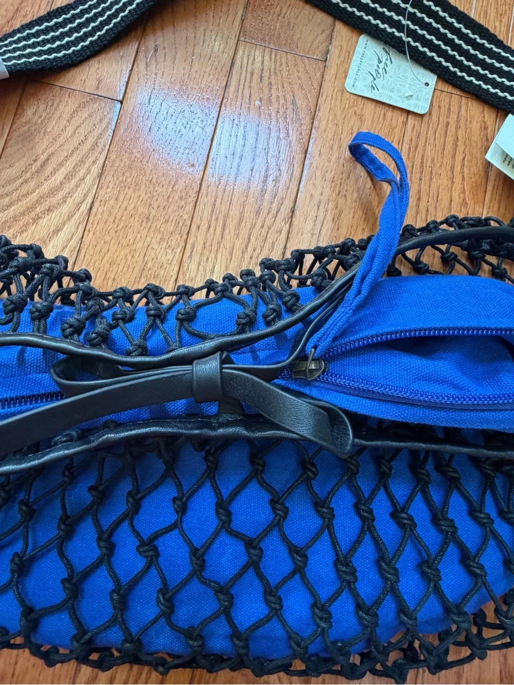 NWT new free people silver springs sling bag black netting netted blue